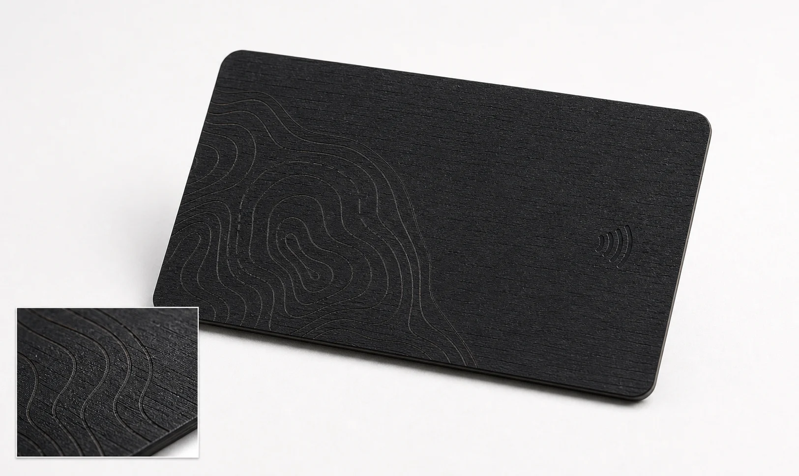 Subtle laser linework on black wood RFID card
